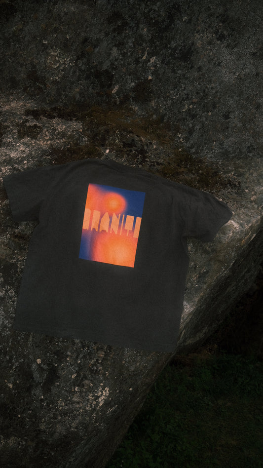Black GRANITE. TEE.02 with colorful grainy gradient in the back and GRANITE. logo